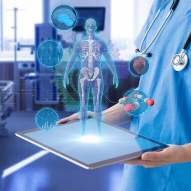A nurse holding a holographic representation of a human body